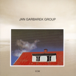 Jan Garbarek - Photo with Blue Sky, White Cloud, Wires, Windows and a Red Roof